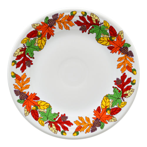 White plate with fall leaves around the edge