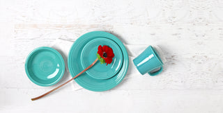 Turquoise place setting on a white wood tablescape