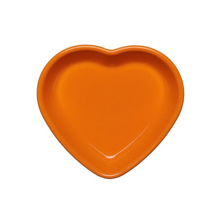The Fiesta Tangerine Small Heart Bowl features smooth edges and a bright orange color, crafted from vitrified china and shown from above against a white background.