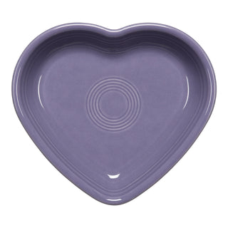 The Fiesta Lavender 7 1/2 Inch Medium Heart Shaped Bowl, 17 OZ, made in USA with smooth edges and concentric circle patterns, is shown from above on a white background.