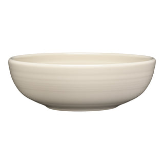 The Fiesta Linen Bistro Coupe 7 5/8 Inch Medium Bowl holds 38 oz and features a smooth, round cream-colored design. Dishwasher, oven, and microwave safe, it's perfect for everyday use. Shown against a white background.