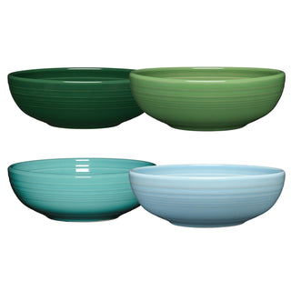 The Fiesta Mixed Aegean Bistro Coupe 7 5/8-Inch 38OZ Medium Bowls, Set of 4, features ceramic bowls in green and blue with a glossy finish and subtle ridges. Dishwasher safe, they're perfect for everyday use.