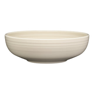The Fiesta Bistro Coupe 9 5/8 Inch Large Bowl holds 68 oz and features a round, shallow design in linen-colored ceramic with a smooth, slightly textured surface and a small base.