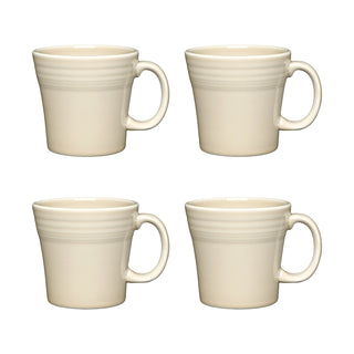 The Fiesta (FTC) Linen 15 OZ Set of 4 Tapered Mugs features four identical cream-colored mugs with handles, arranged in two rows on a white background. Made in the USA from durable, dishwasher-safe china for everyday style.