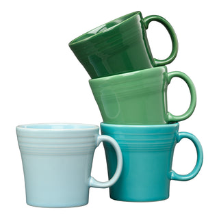 The Fiesta Mixed Aegean 15 OZ Set of 4 Mixed Tapered Mug Set features ceramic mugs in green and blue shades, each stylish, dishwasher safe, and stacked against a white background.