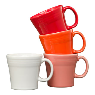 The Fiesta (FTC) Mixed Sunset Horizon 15 OZ Set of 4 Mixed Tapered Mugs features vibrant red, orange, pink, and white mugs stacked against a white background, adding colorful, dishwasher-safe style to your kitchen.