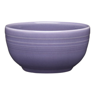 The Fiesta Lavender Bistro Coupe 5 1/2 Inch Cereal Bowl (22 oz) features subtle horizontal rim ridges and a round shape. Shown on a white background, this microwave-safe bowl is perfect for everyday use.