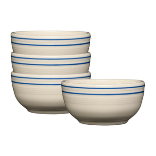 A set of four Fiesta Americana Lapis Bands Bistro Coupe Cereal Bowls (5 1/2 inch, 22 oz) by Fiesta (FTC), cream-colored with double blue rim stripes, is shown—three stacked, one in front—perfect for everyday use and made from lead-safe china.