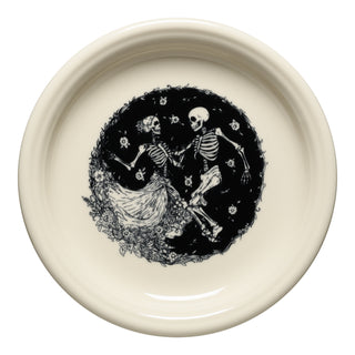 The Fiesta Skeleton Duet Linen Bistro Coupe 7 1/4-Inch Salad Plate is a cream-colored dish featuring two skeletons dancing in a floral circle, ideal for Halloween or Day of the Dead décor.