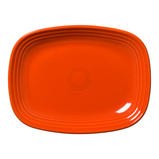 The New Retired Fiesta 12 Inch Large Rectangular Platter by Fiesta, shown in Poppy, features a bright orange hue with rounded edges and a slightly raised, ridged border, displayed on a white background.