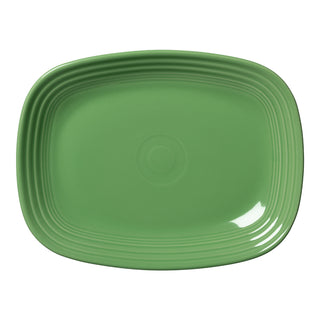 The New Retired Fiesta 12 Inch Large Rectangular Platter by Fiesta, shown in Meadow green, features rounded corners and concentric circular ridges near the edges, displayed from above on a white background.
