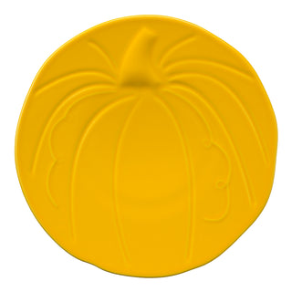 A round, bright yellow plate shaped like a pumpkin with embossed lines suggesting pumpkin ridges and a stem at the top.