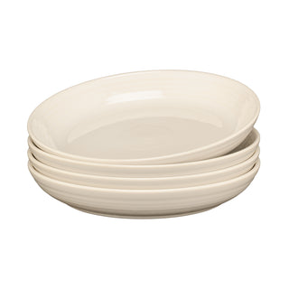 The Fiesta Linen Coupe 8 1/2 Inch Luncheon Bowl, Set of 4 (26 oz), in cream, creates a coordinated table setting when paired with matching plates on a white background.