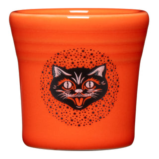 The Fiesta (FTC) Black Cat 1 1/2 OZ Ceramic Shot Glass features a bright orange design with a black cat’s head, wide eyes, and tongue out, encircled by black stars. Made from vitrified china, it’s dishwasher safe for easy cleaning.
