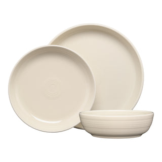 The Fiesta Coupe Bowl 3-Piece Place Setting in Linen features a large dinner plate, salad plate, and coupe bowl with smooth, contemporary designs and subtle circular patterns. This dishwasher safe china makes cleaning easy.