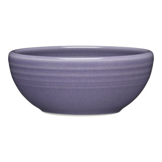 The Fiesta Lavender 3 3/4 Inch Mini Bowl (5 oz) features a simple round shape, smooth matte finish, and subtle horizontal rim lines. Ideal for snacks or dips, it’s shown in purple on a white background.