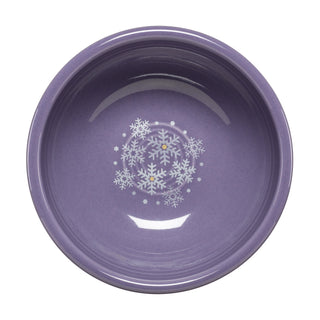 The Fiesta Lavender Snowflakes 3 3/4 Inch Mini Bowl 5 OZ features a round, purple design with white snowflakes—an ideal ceramic bowl for festive winter serving.