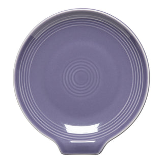 The Fiesta Lavender Extra Large Spoon Rest, 7 inches wide, features concentric ridges and a small handle extension. This glossy ceramic kitchen accessory is round and shown on a white background.