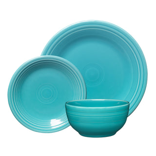 The Fiesta Classic Bistro 3-Piece Place Setting in turquoise includes a dinner plate, salad plate, and cereal bowl with glossy finishes and concentric circle designs, arranged together against a white background.