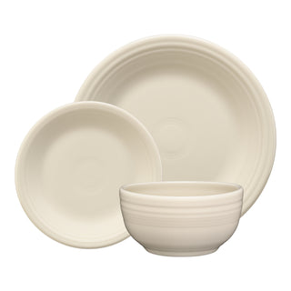 The Fiesta Classic Bistro 3-Piece Place Setting in Linen includes a large plate, smaller plate, and cereal bowl, each featuring a simple ribbed edge design. Service for 1.