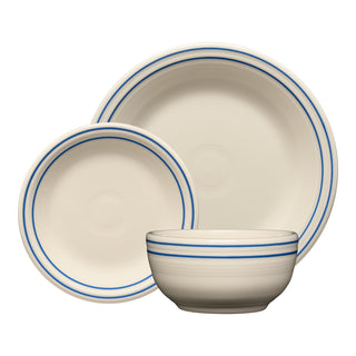 The Fiesta Americana Lapis Band 3-Piece Place Setting, Service For 1, includes a cream ceramic dinner plate, salad plate, and bowl with blue ring accents, all made in the USA and shown on a white background.