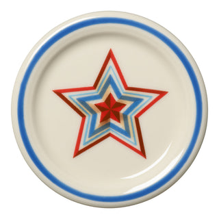 The Fiesta (FTC) Americana Scarlet Faceted Star 4 3/8 Inch Coaster and Mug Cover features a round white design with a blue rim and multicolored concentric stars. Lead-safe china, dishwasher safe for easy cleaning.