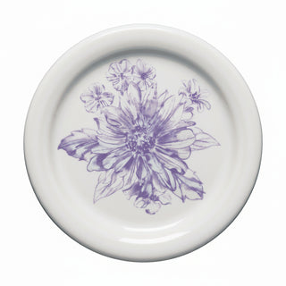 The Fiesta Botanical Floral Lavender 4 3/8 Inch Coaster and Mug Cover is a white ceramic piece featuring a detailed purple floral design with leaves. Made in the USA.