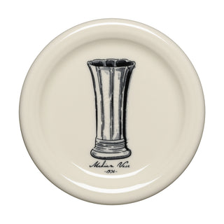 A cream-colored plate from the Fiesta Icons collection features a black illustration of a tall, fluted vase at its center with “Medina Vase 1936” inscribed below in cursive. This lead-safe china piece by Fiesta brings timeless elegance to your table and perfectly complements the Fiesta Icons Medium Vase and Sugar Bowl and Creamer set with Tray, Set of 2, and the matching 4 3/8 Inch Coaster and Mug Covers, Set 3.