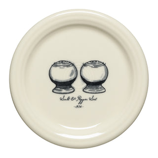 A cream-colored ceramic coaster from the Fiesta Icons Disk Pitcher and Salt and Pepper set features a black illustration of shakers labeled “Salt & Pepper Set - 1934”—a charming nod to classic Fiesta style.