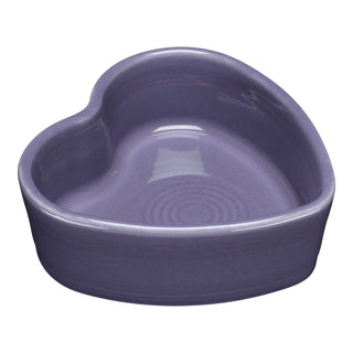 The Fiesta Lavender 7 OZ Heart Shaped Ramekin (4 1/2 Inch) features a glossy, purple ceramic finish with concentric circles on the inside bottom, shown against a white background.