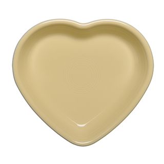 An ivory Retired Fiesta 7 1/2 Inch Medium Heart Shaped Bowl (17 oz) by Fiesta (FTC) is shown from above, featuring smooth edges and a glossy finish, crafted from lead-safe china.