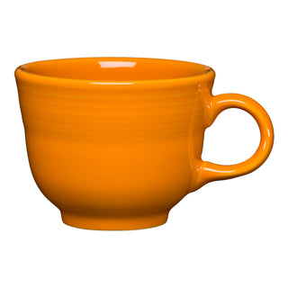 The Fiesta (FTC) Retired Classic 7 3/4 OZ Tea Cup in Butterscotch features a rounded body and curved handle, crafted from vitrified china, shown isolated on a white background.