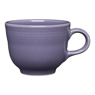 A Lavender Classic 7 3/4 OZ Tea Cup by Fiesta, made in the USA, with a handle is displayed against a white background.