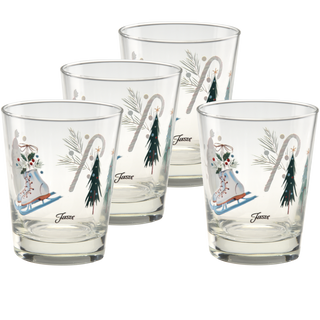 Set of four 15 oz. Fiesta Jolly Christmas Tapered Double Old Fashion glasses from Moderne Glass, each featuring festive designs of ice skates, candy canes, pine trees, and pine branches, along with the word “Jussst.” Proudly made in the USA.