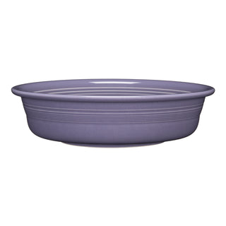 The Fiesta Lavender Classic Rim 10 1/2 Inch Extra Large Serving Bowl (80 OZ) is crafted from lead-safe china in a solid lavender color with subtle horizontal lines along the rim for added style and peace of mind.