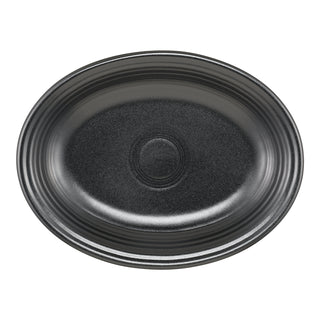 The Fiesta (FTC) Foundry 11 5/8 Inch Medium Oval Serving Platter features a black, subtly textured finish with concentric ridge patterns, perfect as a microwave safe side dishes platter, shown from above on a white background.
