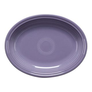 The Fiesta Lavender 11 5/8 Inch Medium Oval Serving Platter, made in the USA, features a glossy finish and concentric ridges—ideal for serving side dishes.