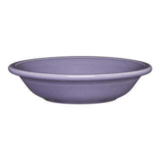 The Fiesta Lavender Fruit Bowl is a shallow, round ceramic bowl made in the USA with a slightly flared rim, shown against a white background.