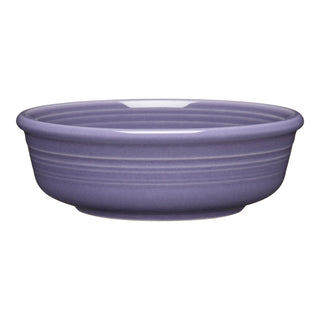 The Fiesta Lavender Classic Rim 5 5/8 Inch Small Bowl (15 OZ) features a glossy finish in muted purple, subtle exterior ridges, is dishwasher safe, and proudly made in the USA.