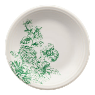 The Fiesta Botanical Floral Jade Classic Rim 7 1/4 Inch Salad Plate features a white ceramic base with a green floral motif along one side and is part of our elegant Botanical Floral ceramic dinnerware collection.