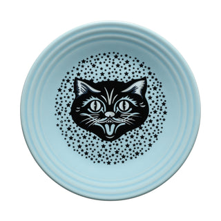 Introducing the Black Cat Sky Classic Rim 9 Inch Luncheon Plate by Fiesta—a light blue, vitrified china plate decorated with a black and white illustration of a cat’s head encircled by small black stars. This plate is dishwasher safe and proudly made in the USA.