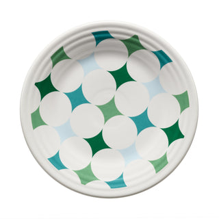 The Fiesta Aegean Kaleido Circles Classic Rim 9 Inch Luncheon Plate features a white ceramic surface adorned with a geometric circular, star-like pattern in green, teal, and blue shapes. This dishwasher-safe china plate is perfect for luncheons and showcases the signature Fiesta style.