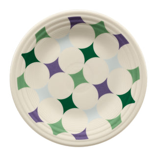The Fiesta Lavender Bloom Kaleido Circles Classic Rim 9 Inch Luncheon Plate features a modern, symmetrical design with green, purple, and light blue stars in white circles on cream—an abstract touch to elevate your plate collection.