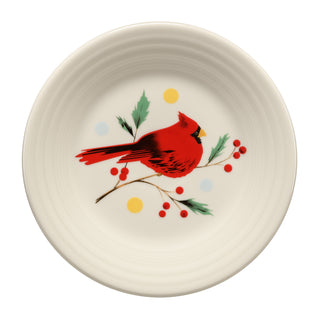 Introducing the Fiesta Jolly Christmas Cardinal Classic Rim 9 Inch Luncheon Plate—a cream-colored holiday plate adorned with a red cardinal perched on a holly branch surrounded by green leaves, red berries, and accents of yellow and blue dots. Part of the Jolly Christmas Collection, this charming plate brings festive elegance to your seasonal table setting.