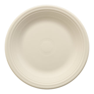 The Fiesta Classic Rim 10 1/2 Inch Dinner Plate in Linen features a smooth surface with subtle rim ridges, made in the USA to showcase exceptional craftsmanship, shown from above on a white background.