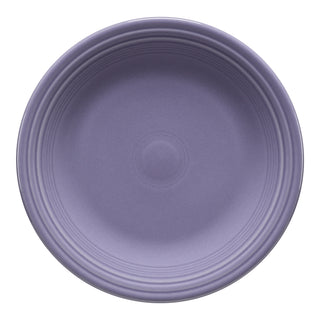 A Fiesta Lavender Classic Rim 10 1/2 Inch Dinner Plate, showcasing American craftsmanship, features a smooth lavender surface with subtle concentric ridges near the rim and is displayed from above on a white background.