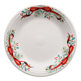The Fiesta Holly Berry Christmas Garland Classic Rim 10 1/2 Inch Dinner Plate features festive red ribbons, green pine, red berries, and blue leaves—perfect holiday dinnerware for your Christmas table.