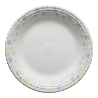 The Fiesta (FTC) White Snowflake Classic Rim 10 1/2 Inch Dinner Plate features a white center with a decorative rim of blue snowflakes and gold dots—ideal holiday tableware to add festive style to your dinner setup.
