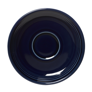 The Fiesta (FTC) Retired Classic Rim 5 7/8 Inch Saucer in Cobalt features glossy, vitrified china with concentric circular ridges near the rim and a round shape, shown from an overhead view.