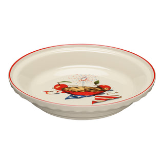The Fiesta Americana Apple Pie 10 1/4 Inch Deep Dish Pie Baker (44oz) features a white dish with a red rim, apple pie and apples illustration, American flag banner, and fireworks. Made in the USA.